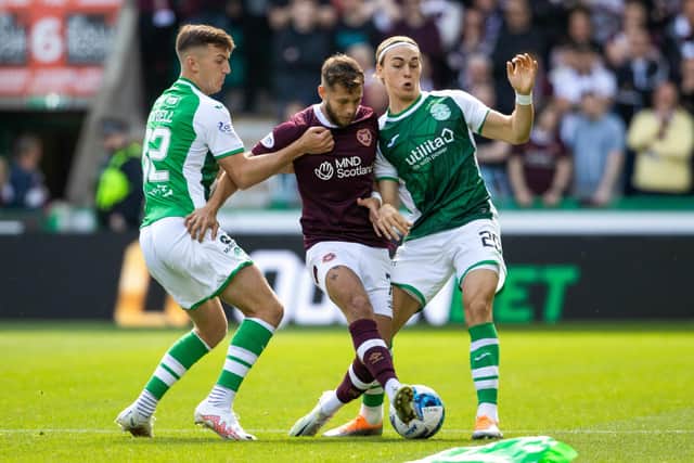 Hearts midfielder Jorge Grant challenged by Hibs duo Josh Campbell (left) and Elias Melkersen. (Photo by Alan Harvey / SNS Group)