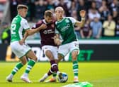 Hearts midfielder Jorge Grant challenged by Hibs duo Josh Campbell (left) and Elias Melkersen.  (Photo by Alan Harvey / SNS Group)