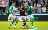 Hearts midfielder Jorge Grant challenged by Hibs duo Josh Campbell (left) and Elias Melkersen.  (Photo by Alan Harvey / SNS Group)