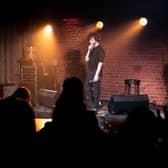 Stand-up comedian in venue Pic: Adobe/Mikalai Bachkou