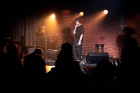 Stand-up comedian in venue Pic: Adobe/Mikalai Bachkou