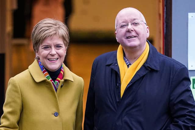 Nicola Sturgeon votes with her husband Peter Murrell in December 2019