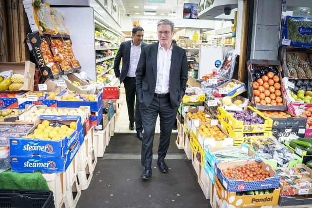 Labour Party leader Sir Keir Starmer (foreground) and Anas Sarwar, leader of the Scottish Labour Party, during a visit to the Stalks & Stem store, a small business in Shawlands, Glasgow. Picture: Jane Barlow/PA Wire