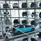 Electric cars are stacked in a storage tower following assembly at the Gläserne Manufaktur production facility in Dresden, Germany (Picture: Sean Gallup/Getty Images)