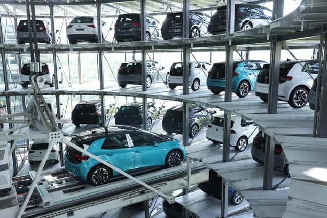 Electric cars are stacked in a storage tower following assembly at the Gläserne Manufaktur production facility in Dresden, Germany (Picture: Sean Gallup/Getty Images)