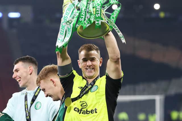 Hart lifts the trophy in front of his family.