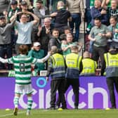 Kyogo Furuhashi takes the acclaim of the Celtic support after scoring against Hearts at Tynecastle.