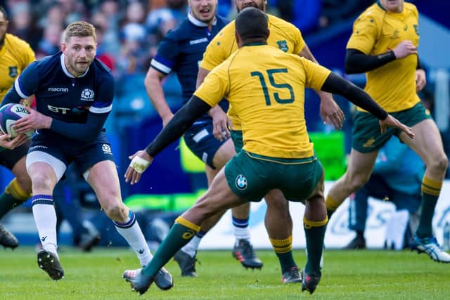 Russell takes on Beale during Scotland's record 53-24 win over Australia in 2017. Picture: Bill Murray/SNS