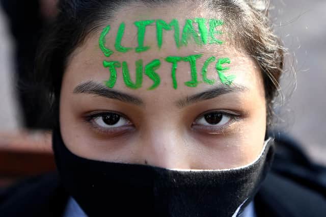 An activist takes part in a climate change protest in Kathmandu earlier this week (Picture: Prakash Mathema/AFP/Getty Images)