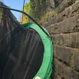 A trampoline was caught between a train and an embankment in Glasgow as Storm Aiden battered Scotland with rain and high winds. Picture: @ScotRail/Twitter/PA Wire.