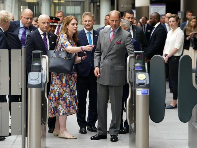 The Earl of Wessex uses an oyster card to go through barriers to ride on a Elizabeth Line train at Paddington station in London, to mark the completion of London's Crossrail project.
