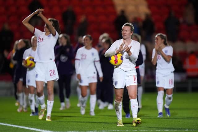 England's Lauren Hemp celebrates with the match ball after a 20-0 win over Latvia.