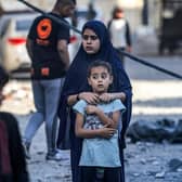 Youths look on during the search for the bodies of survivors and victims of a building collapse after Israeli bombardment in Rafah in the southern of Gaza Strip. Picture: Mohammed Abed/AFP via Getty Images