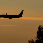 A plane coming in to land at an Airport. PIC: Peter Byrne/PA Wire