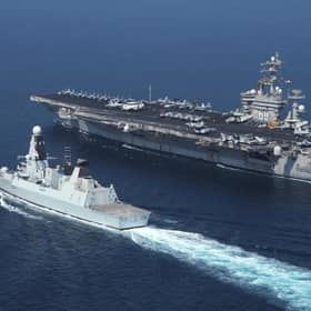 Library picture of Royal Navy destroyer HMS Diamond (left) alongside the aircraft carrier USS Dwight D. Eisenhower. Picture SWNS