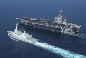 Library picture of Royal Navy destroyer HMS Diamond (left) alongside the aircraft carrier USS Dwight D. Eisenhower. Picture SWNS