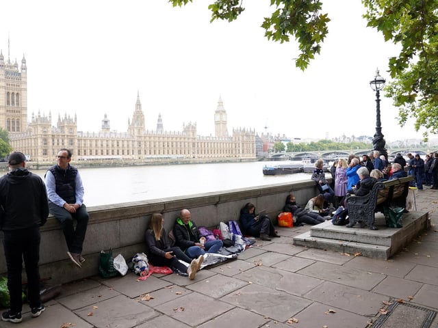 Members of the public wait in the queue near Lambeth Bridge in central London, to view Queen Elizabeth II lying in state ahead of her funeral on Monday. Picture date: Wednesday September 14, 2022.