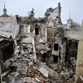 Mariupol's drama theatre, pictured in April, was reduced to rubble and hundreds of women and children sheltering inside were killed during the Russian attack on the city (Picture: Alexander Nemenov/AFP via Getty Images)