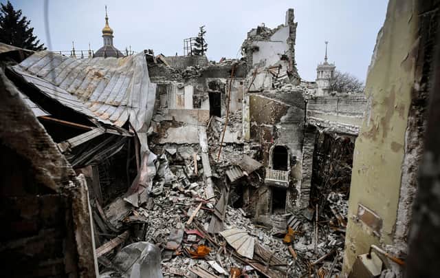 Mariupol's drama theatre, pictured in April, was reduced to rubble and hundreds of women and children sheltering inside were killed during the Russian attack on the city (Picture: Alexander Nemenov/AFP via Getty Images)
