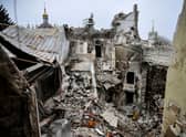 Mariupol's drama theatre, pictured in April, was reduced to rubble and hundreds of women and children sheltering inside were killed during the Russian attack on the city (Picture: Alexander Nemenov/AFP via Getty Images)