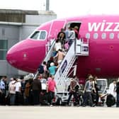 A Whizz Air plane on the apron at Edinburgh Airport