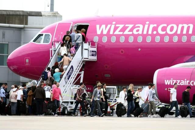 A Whizz Air plane on the apron at Edinburgh Airport