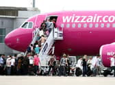 A Whizz Air plane on the apron at Edinburgh Airport
