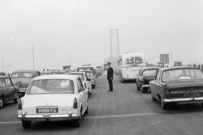 Forth Road Bridge traffic - cars and buses tail-back at the toll booths in 1964.