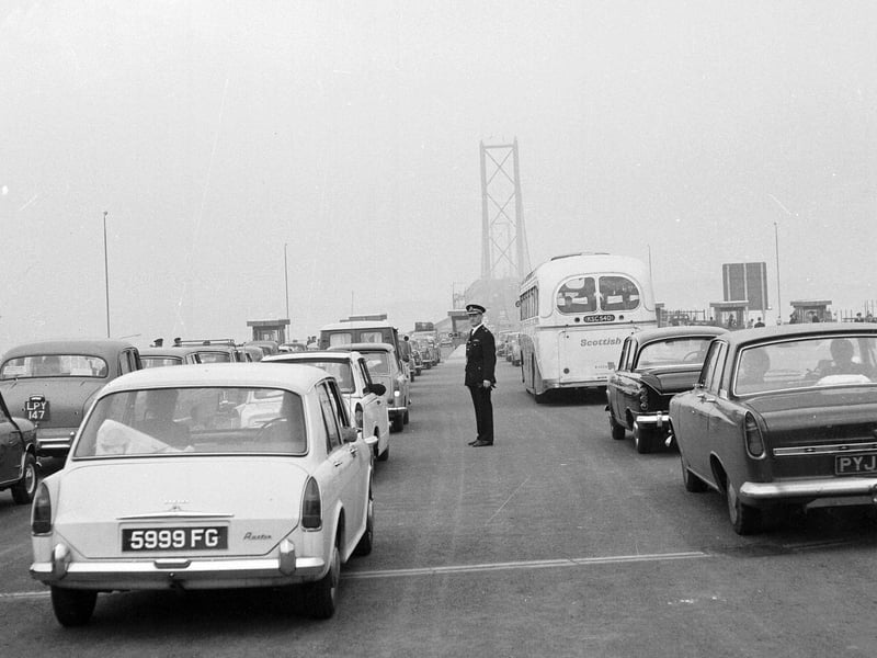Forth Road Bridge traffic - cars and buses tail-back at the toll booths in 1964.