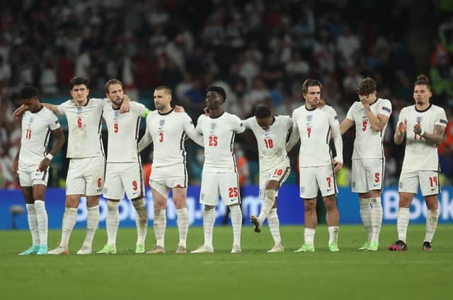English players dejected in the final penalty shoot out of Euro 2020