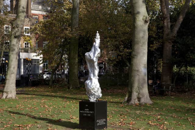 Maggi Hambling's 'A Sculpture for Mary Wollstonecraft' on Newington Green, London, has a small, naked female figure at the top (Picture: Ioana Marinescu /PA Wire)