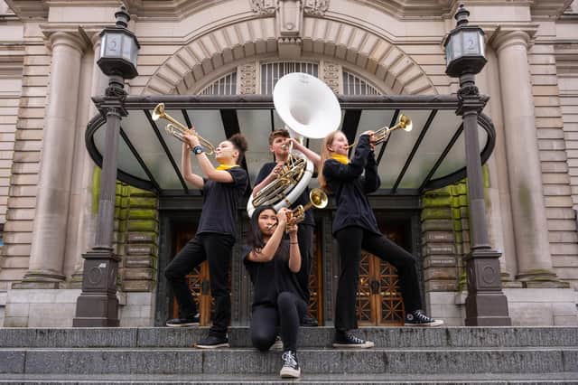 Isabella OSullivan, Heiyi Lok, Alex Wishart and Summer Williamson from the group Oi Musica perform outside the Usher Hall ahead of their appearance in this year's Edinburgh International Festival. Picture: Maxime Ragni