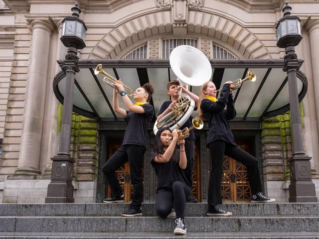 Isabella OSullivan, Heiyi Lok, Alex Wishart and Summer Williamson from the group Oi Musica perform outside the Usher Hall ahead of their appearance in this year's Edinburgh International Festival. Picture: Maxime Ragni