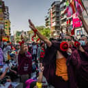 Buddhist monks shout slogans and make three-finger salutes during a protest on February 10, 2021 in Yangon, Myanmar, a week after the country's military junta staged a coup against the elected National League For Democracy (NLD) government and detained de-facto leader Aung San Suu Kyi. Photo by Hkun Lat/Getty Images