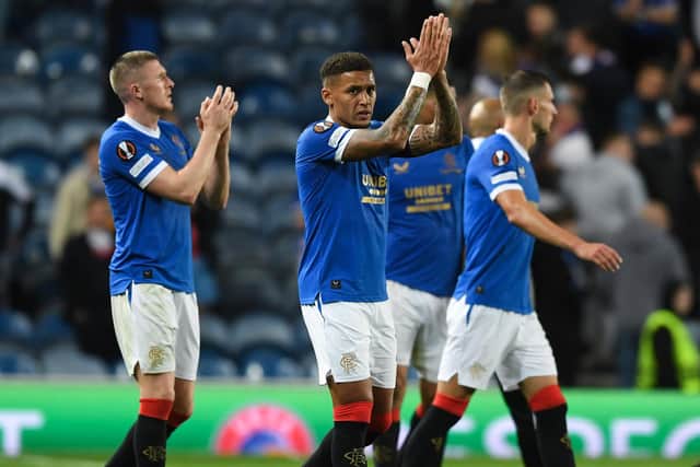 Rangers players applaud their fans after a disappointing night. Picture: SNS