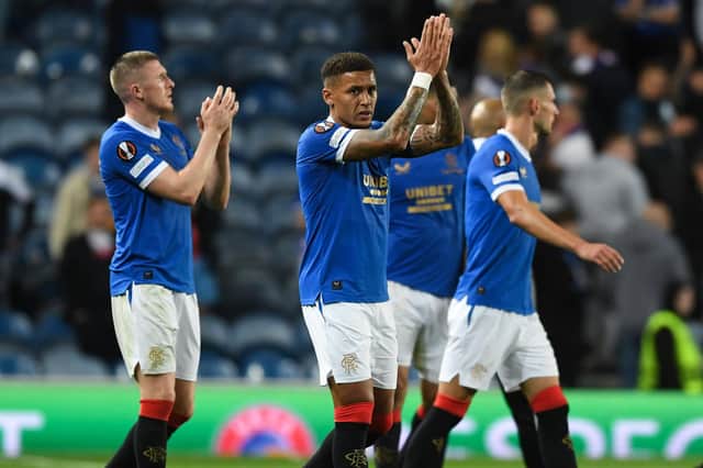 Rangers players applaud their fans after a disappointing night. Picture: SNS