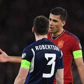 Spain captain Rodri remonstrates with his Scotland counterpart Andy Robertson.
