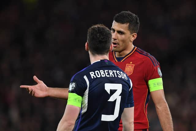 Spain captain Rodri remonstrates with his Scotland counterpart Andy Robertson.
