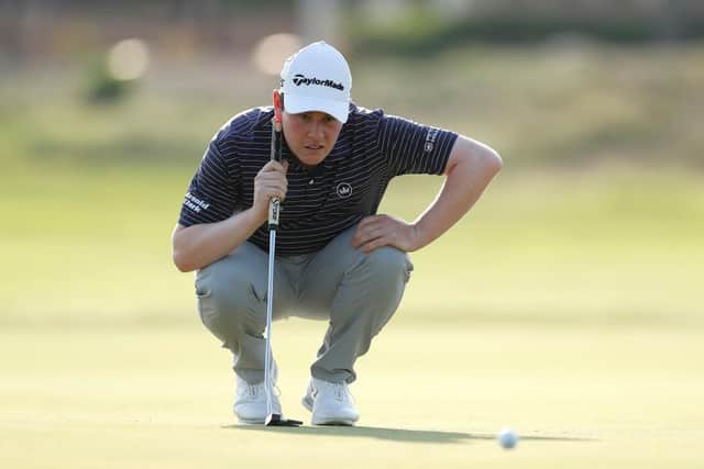 Bob MacIntyre lines up a putt during the first round of the AVIV Dubai Championship on the Fire Course at Jumeirah Golf Estates. Picture: Oisin Keniry/Getty Images.