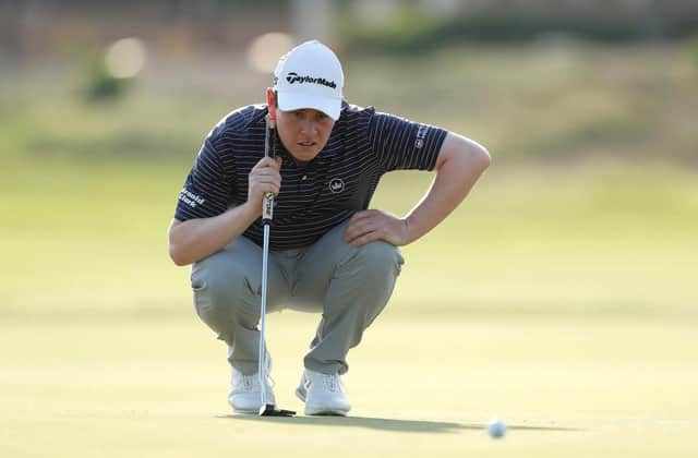 Bob MacIntyre lines up a putt during the first round of the AVIV Dubai Championship on the Fire Course at Jumeirah Golf Estates. Picture: Oisin Keniry/Getty Images.