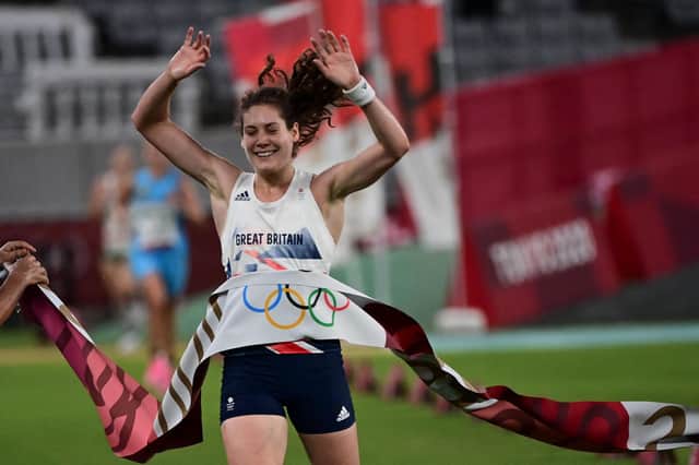 Kate French crosses the finish line of the women's individual laser run winning the gold medal in the modern pentathlon