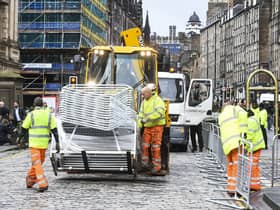 Barriers are beginning to be put on place on the Royal Mile in preparation of the Queen's body arriving in Edinburgh. Picture: Lisa Ferguson