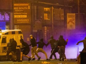 Rioters clash with police in the Sandy Row area of Belfast (Picture: Donal Collins/PA)