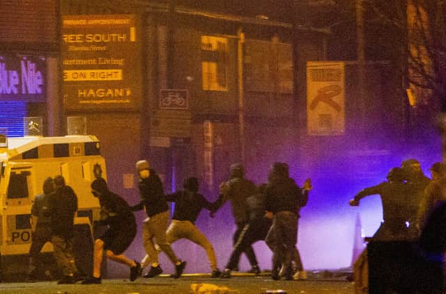 Rioters clash with police in the Sandy Row area of Belfast (Picture: Donal Collins/PA)