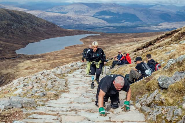 Paul Ellis, 57, from Widnes, Cheshire, on the gruelling stretch between the Halfway Lochan' and the summit of Ben Nevis.
Pic:Lucy McAlpine Photography/ SWNS