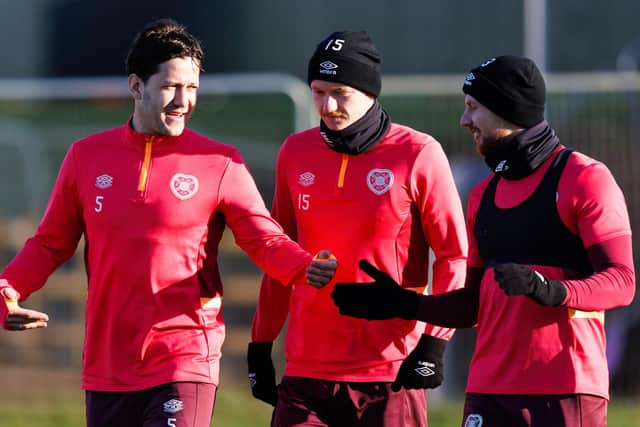 Hearts' Peter Haring (L), Kye Rowles and Stephen Kingsley during a training session ahead of facing Motherwell.