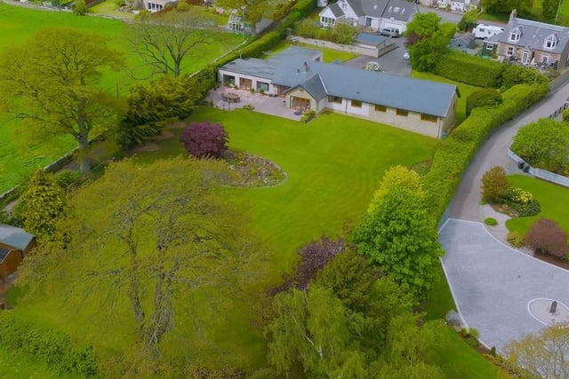 Aerial view of house and gardens.