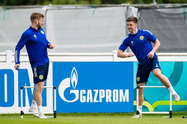 Kieran Tierney (right) returned to full training with the Scotland squad on Thursday and was all smiles as he worked alongside Stuart Armstrong (left). (Photo by Ross Parker / SNS Group)
