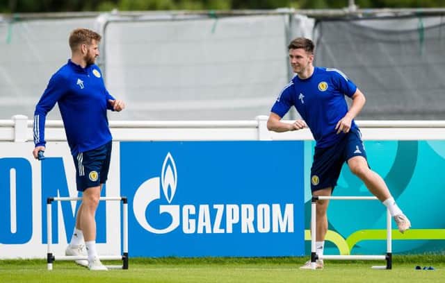 Kieran Tierney (right) returned to full training with the Scotland squad on Thursday and was all smiles as he worked alongside Stuart Armstrong (left). (Photo by Ross Parker / SNS Group)