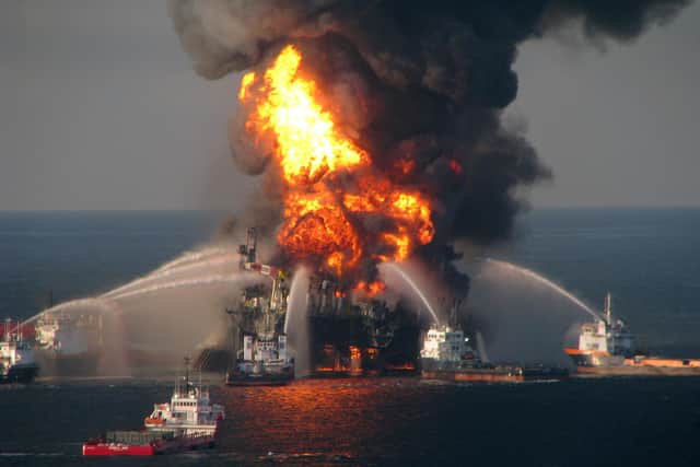 Fire boat response crews battle the blazing remnants of the off shore oil rig Deepwater Horizon in 2010. The explosion  killed 11 workers and polluted the coastline from Louisiana to Florida